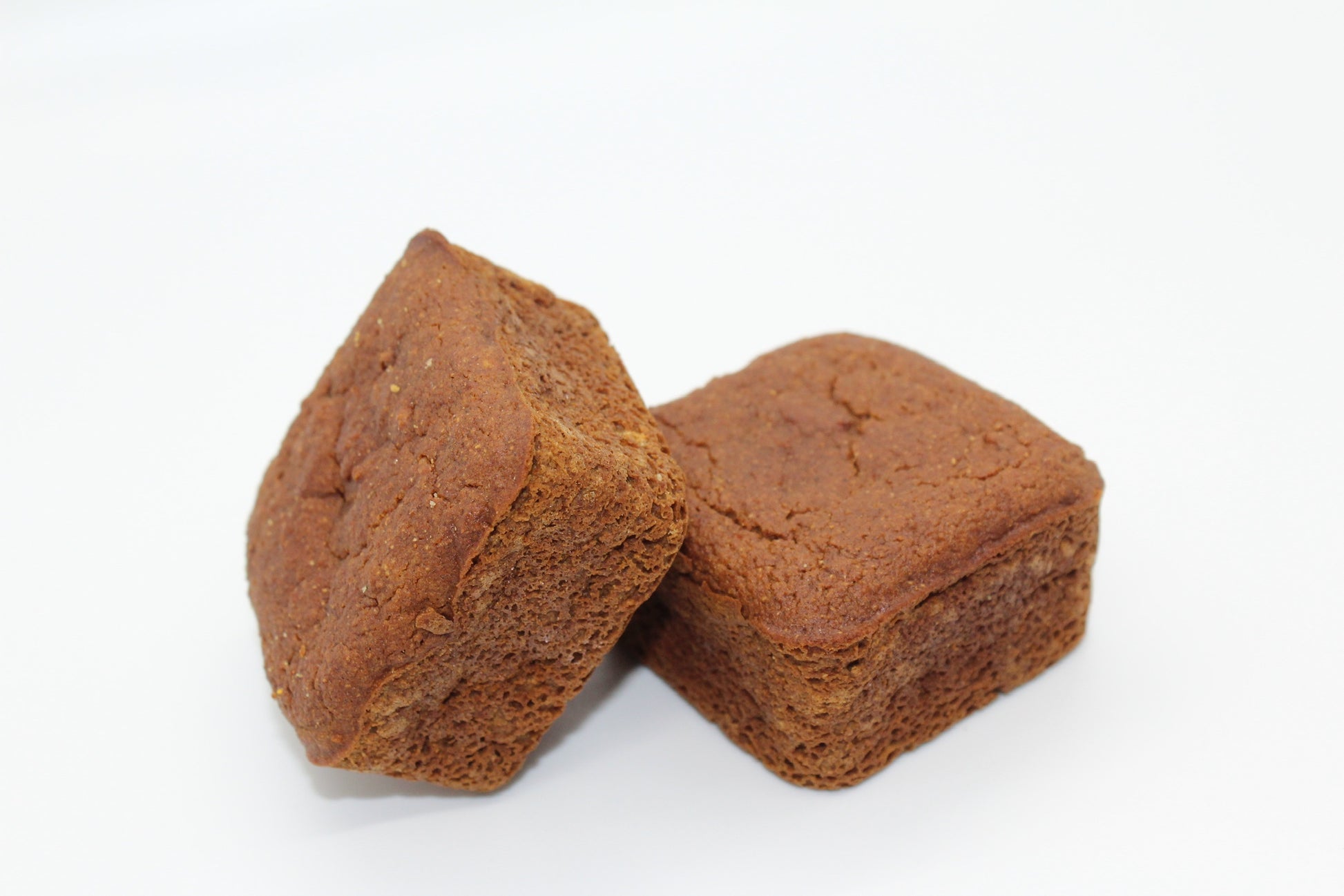 Two delicious plain sweet potato and carrot mini dog cakes.