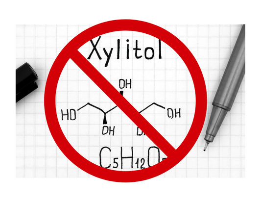 the chemical composition of Xylitol with a red circle and a slash over it.