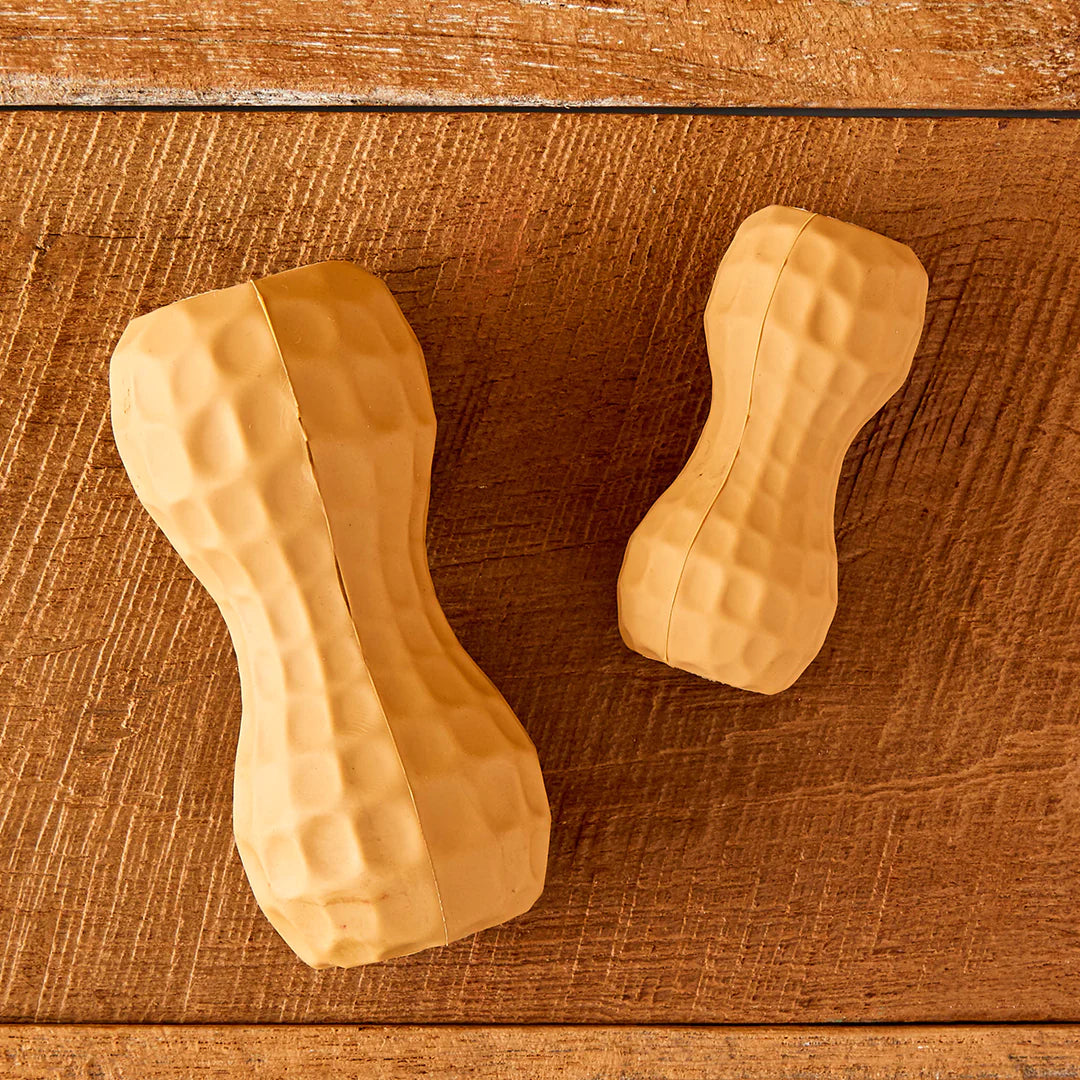 Image of 2 tan peanut shaped dog chew toy fillers laying side by side. One is medium size the other is small.