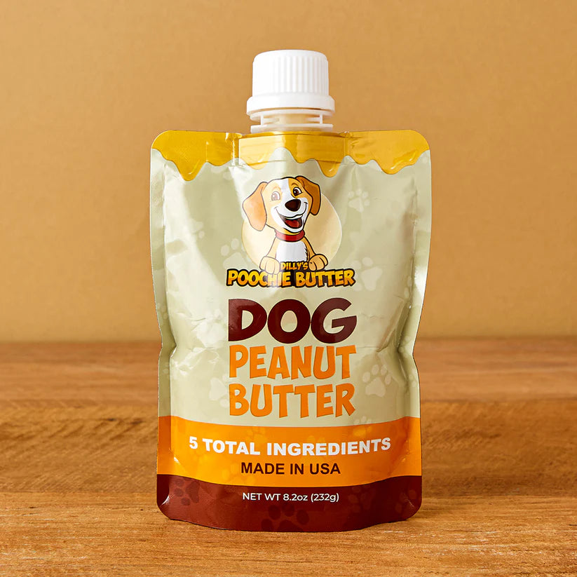 a 8.2 ounce peanut butter squeeze pack. The packaging on the squeeze pack features a smiling dog. The Packaging states "dog peanut butter. 5 total ingredients. made in USA.