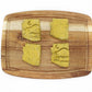Delicious Broccoli and Peas based dog treat. Four green treats  sit on a cutting board.  All treats are cut in the shape of the State of Arizona, two have a desert theme stamped into them.